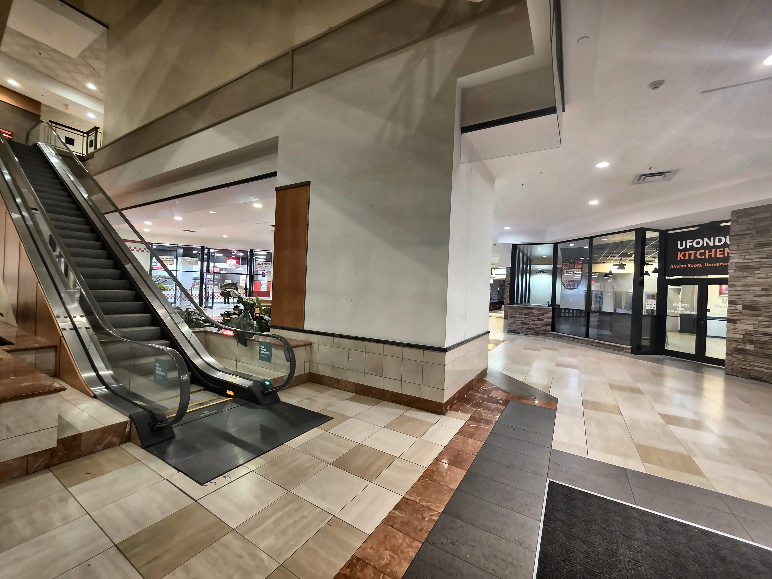 The view from the mall corridor — look for the Ufondu Kitchen sign by the escalators.