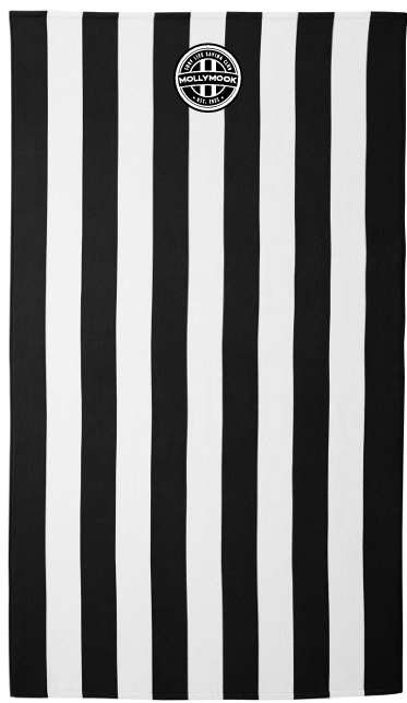 Full-length black-and-white small-stripe plush beach towel with a small circular Mollymook club badge near the top.