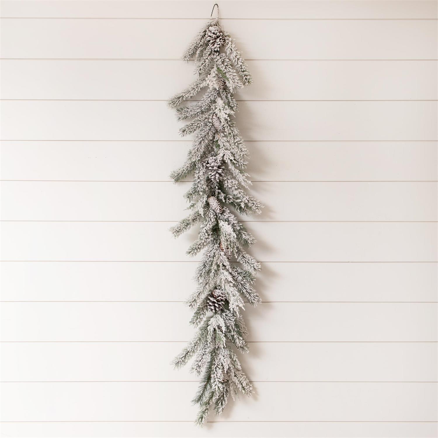 Flocked garland with pinecones