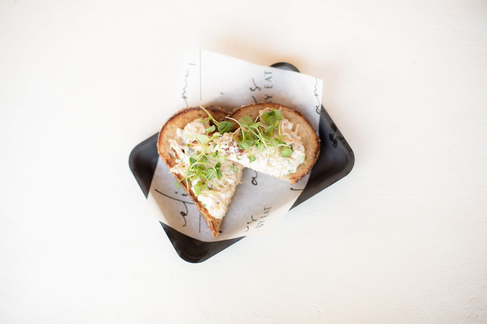 Chicken Salad Toast — EAT signature chicken salad, local micro greens, seeded noble toast or mixed greens | sub gf 2