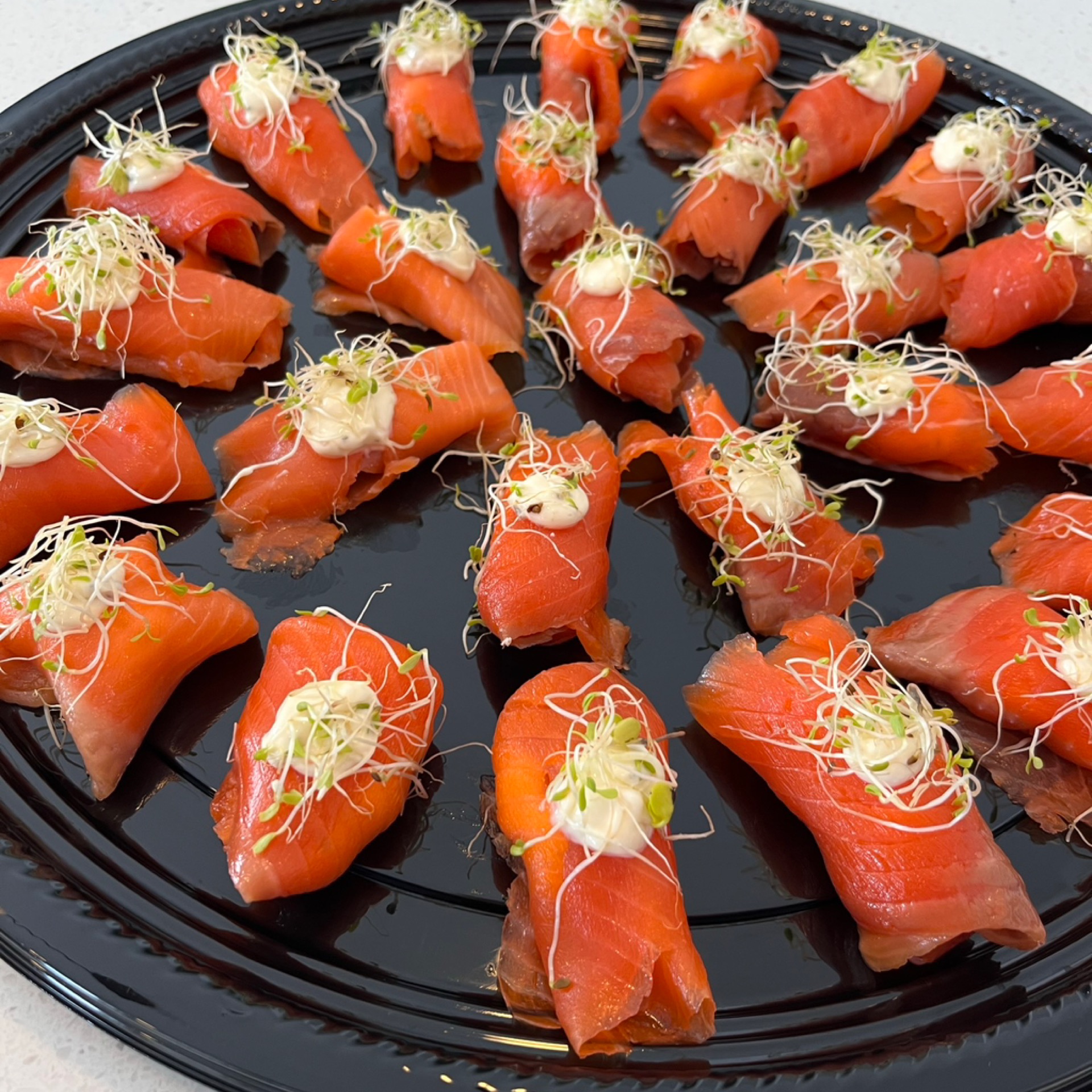 Rolled platter of Boursin cheese and smoked salmon with savory herb mayonnaise