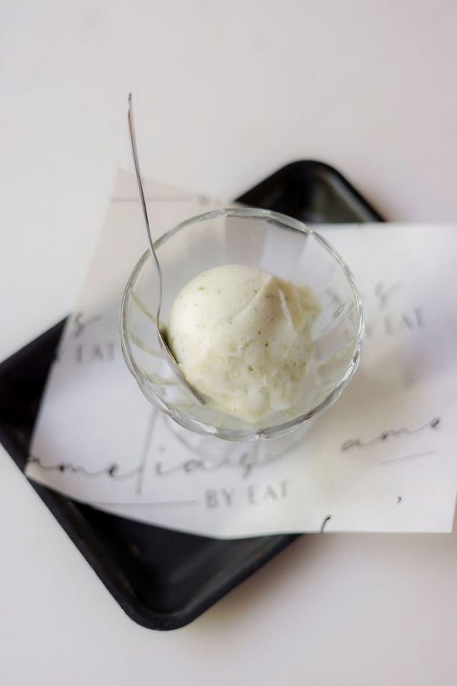 Scoop of Sweet Republic seasonal sorbet in a glass dish on an Amelia's tray