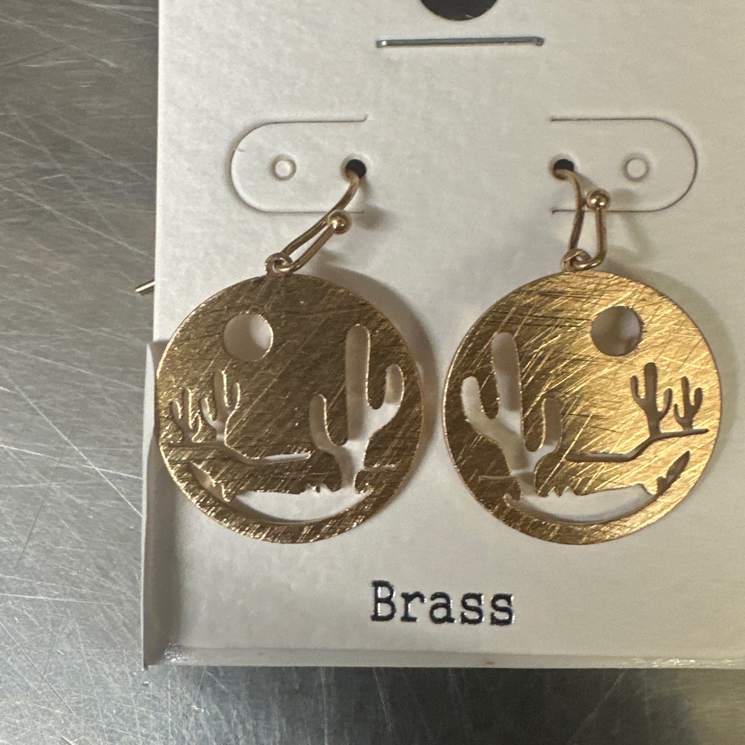 Gold toned desert scene cut out circle disc dangle