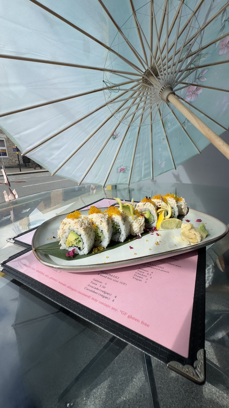 Snow Crab California Roll - Avocado, cucumber and mango filled. Topped with sn