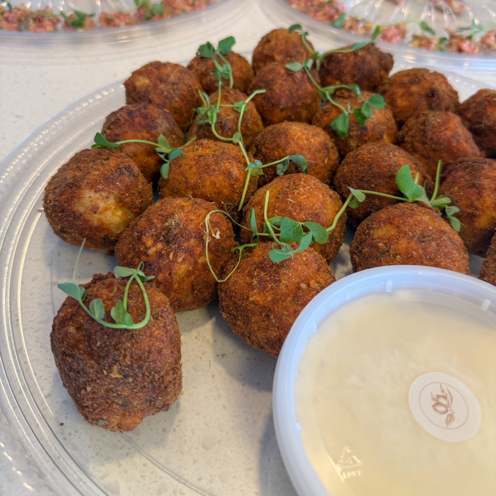 Platter of arancini and truffle cream