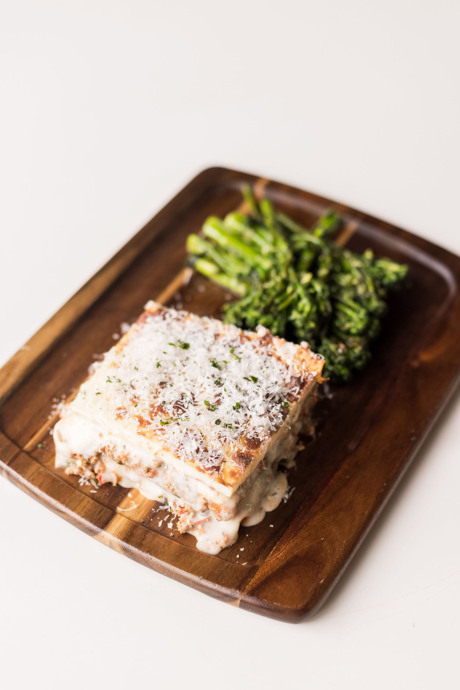 Italian Board — italian lasagna - zucchini "noodles", ground pork + beef, three cheeses, slow cooked marinara; garlic herb