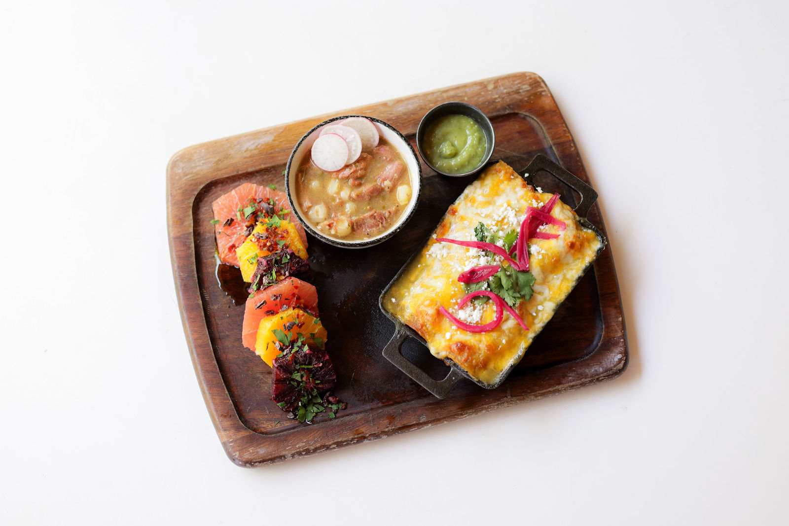 Southwest Board — enchilada - house made organic corn tortilla, creamy chicken + rice, hatch chili sauce, pickled red onion