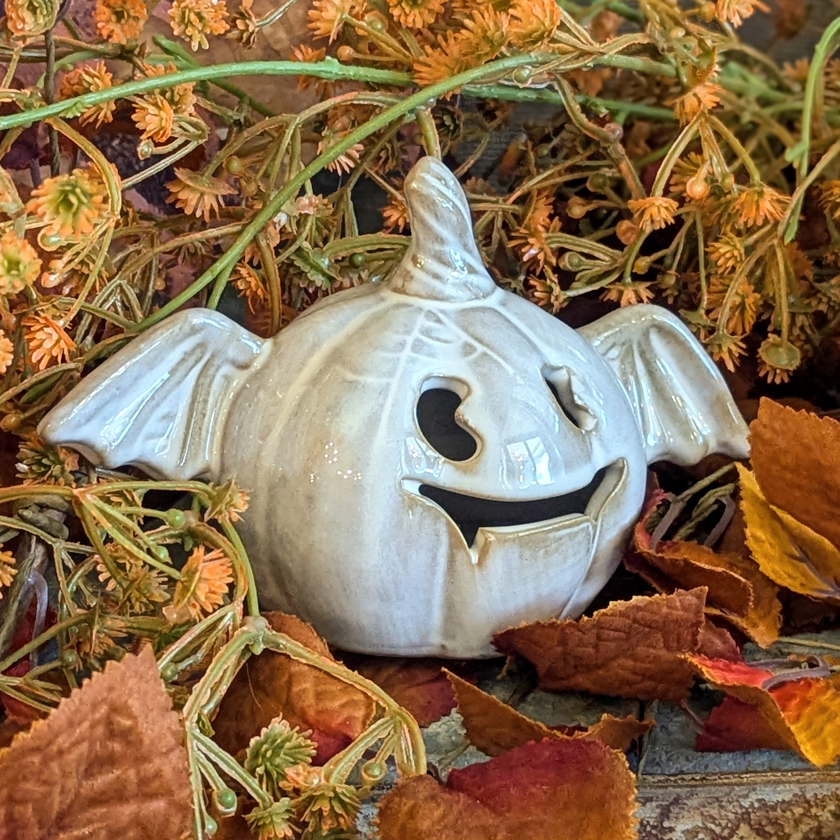 Stoneware lighted pumpkin bat figurine