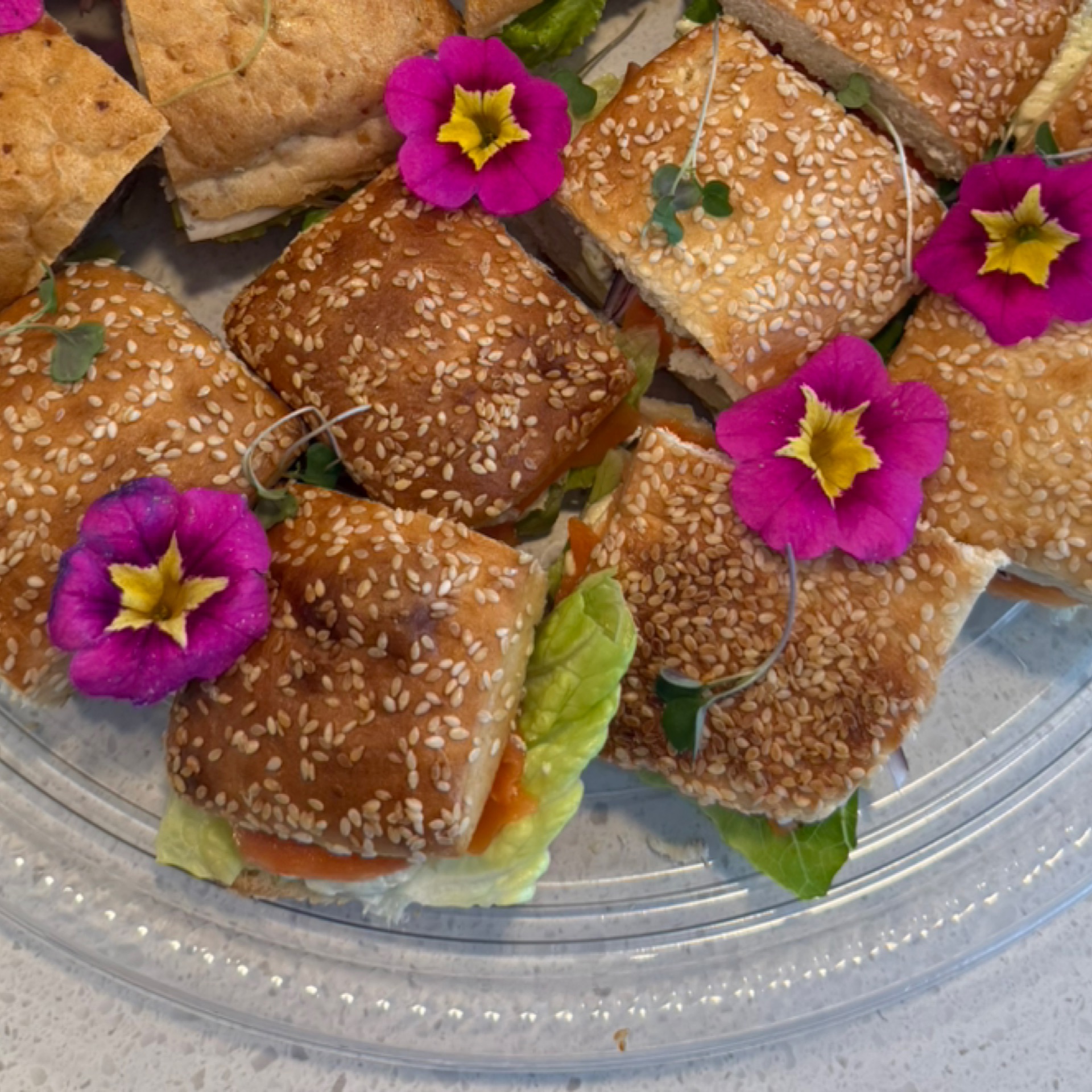 Sandwich platter with sesame bread, cream cheese, dill & smoked salmon