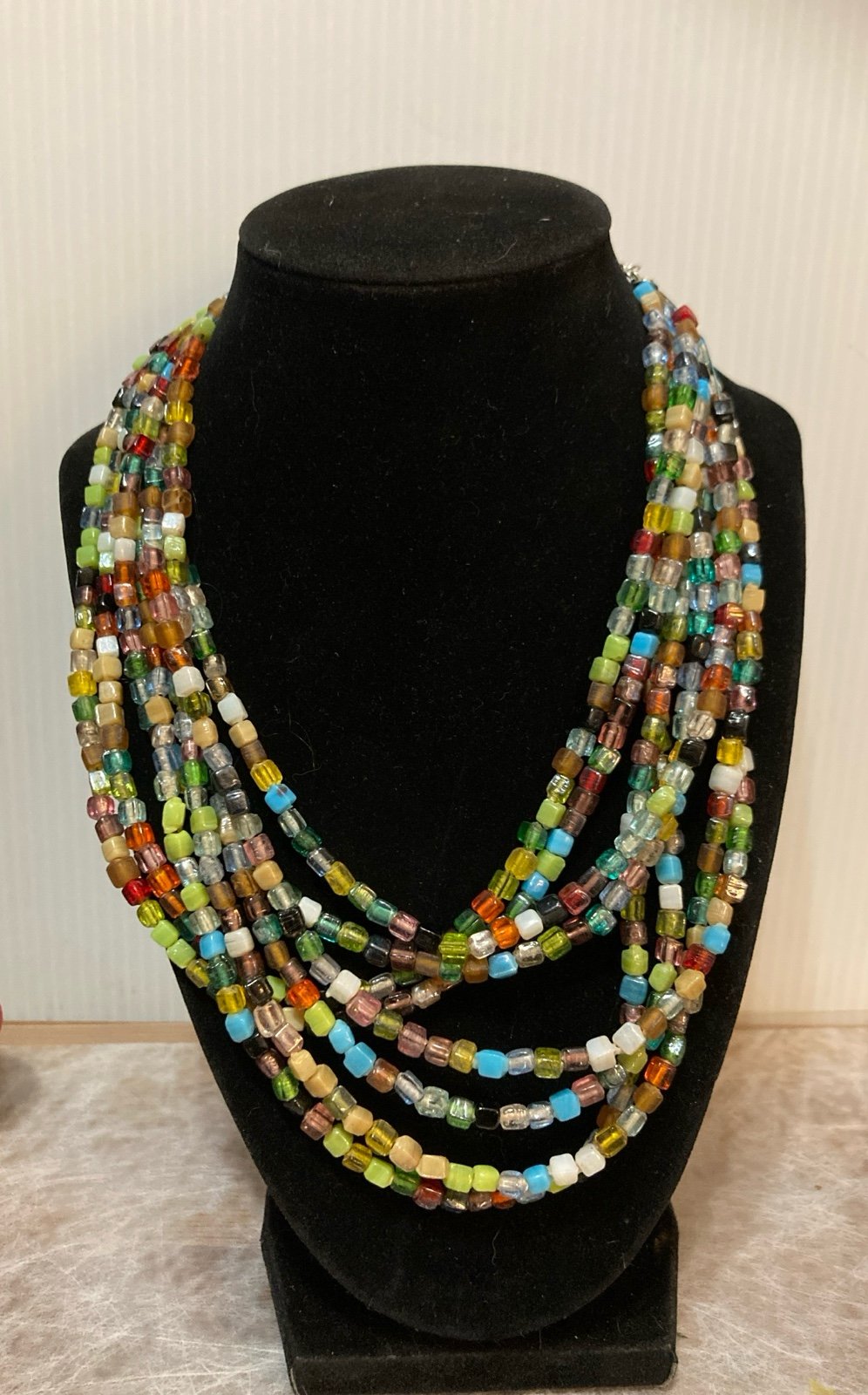 ZAD multi-strand, multi-color glass beaded necklace.