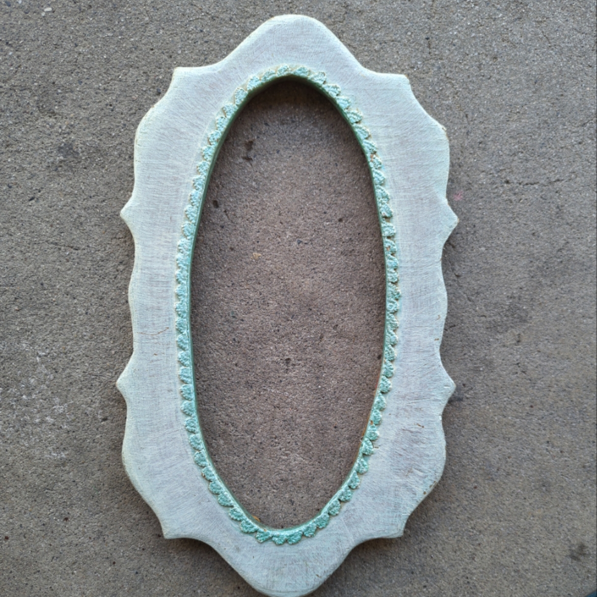 Vintage handmade oval shaped frame with scalloped edges