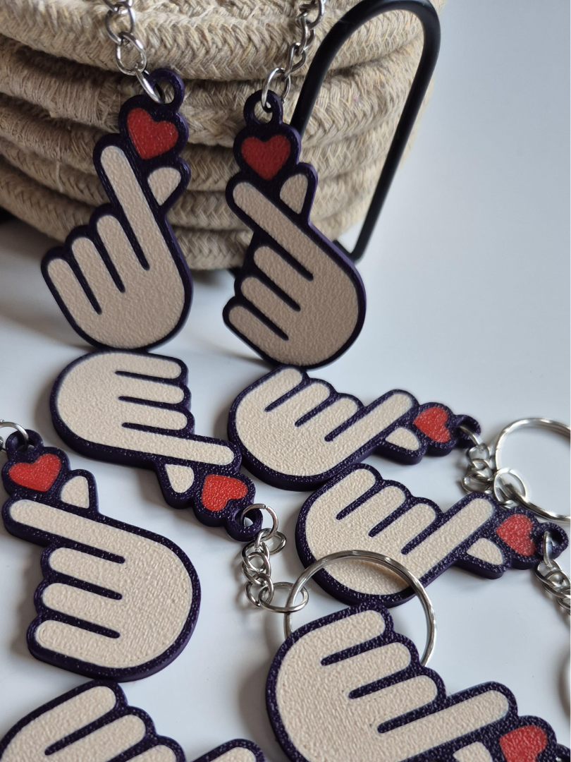 This Heart Emoji Keychain features an adorable design crafted from durable materials, ensuring it lasts through daily use. A fun and practical accessory, it's also a perfect gift idea for loved ones or friends.