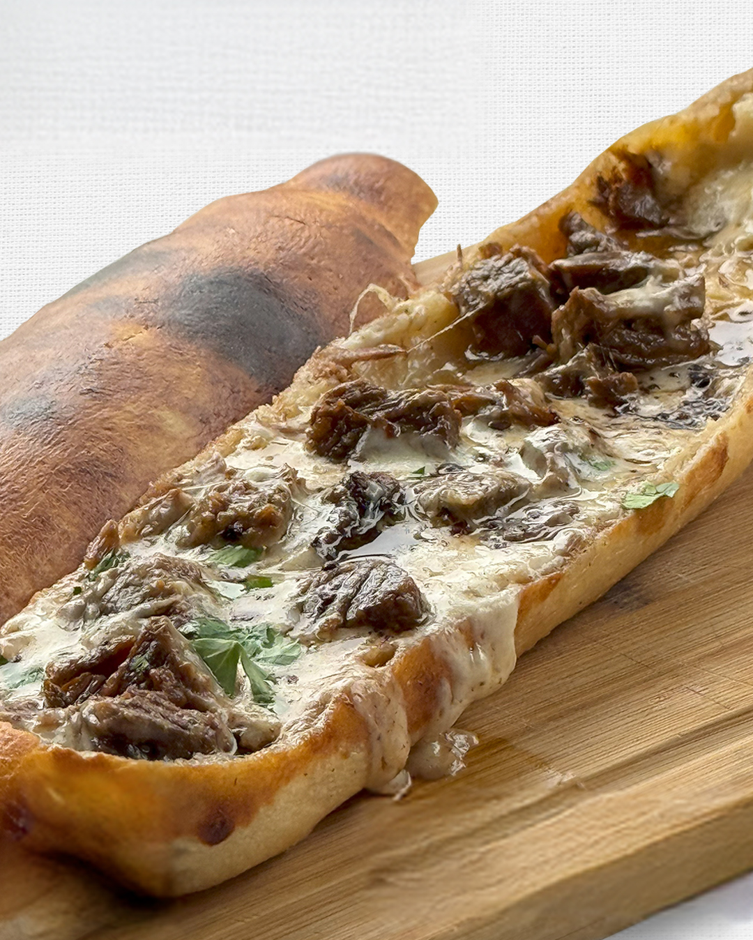 Kavurmali Pide at Jass Kitchen in Miami, FL 33137 | YourMenu® Online Ordering