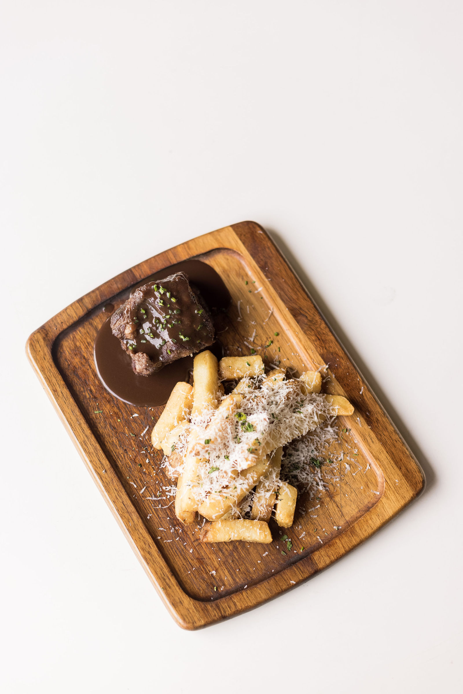 Meat + Potatoes Board — Red wine braised beef short rib, beef jus, steak fries, herbs, parmesan