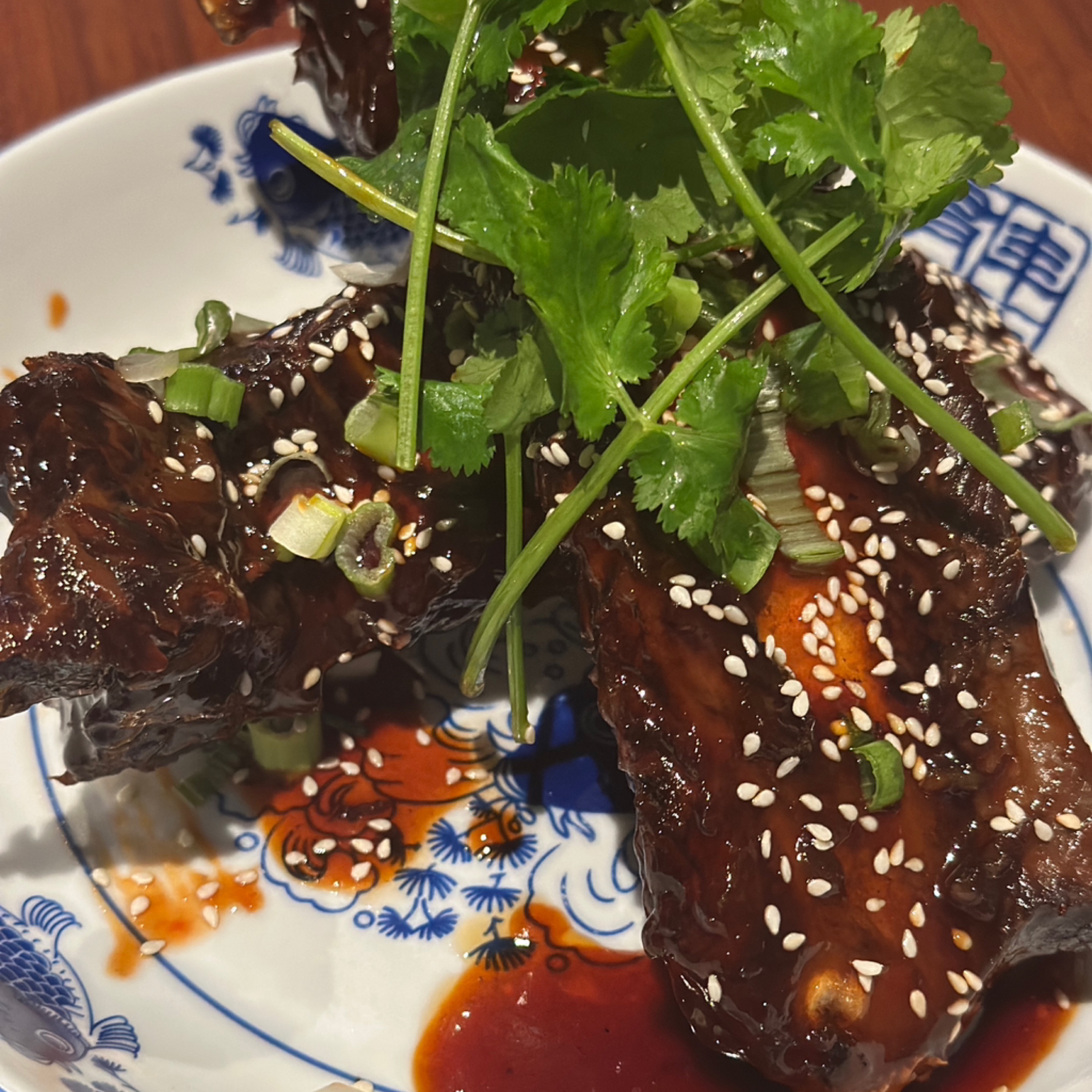 Big Beef Ribs with house bbq sauce and side of fries.