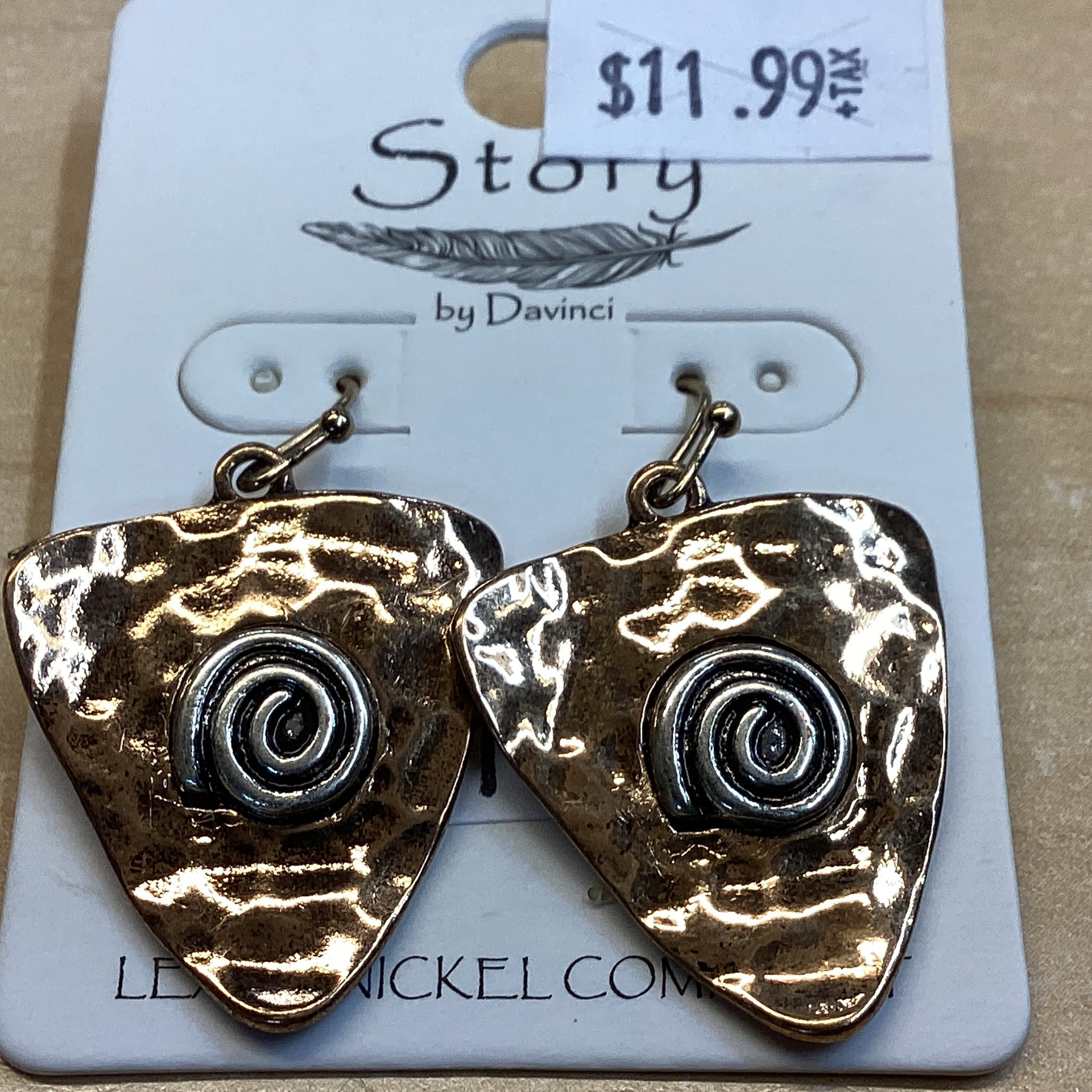 Arrowhead gold toned w/ silver swirl
