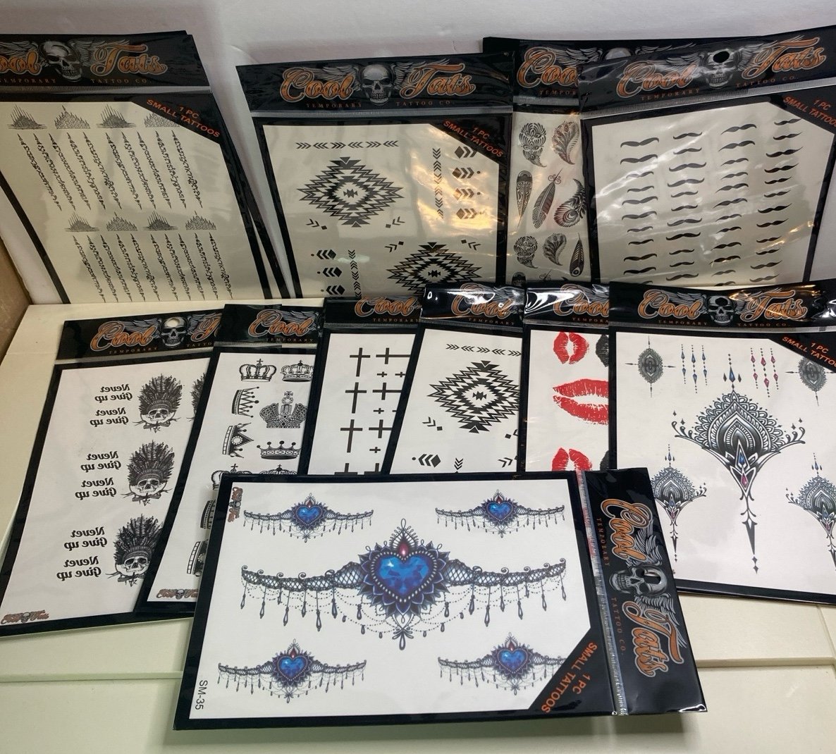 COOL TEMPORARY TATTOOS LOT LIPS CROSS FEATHERS PLUS MORE