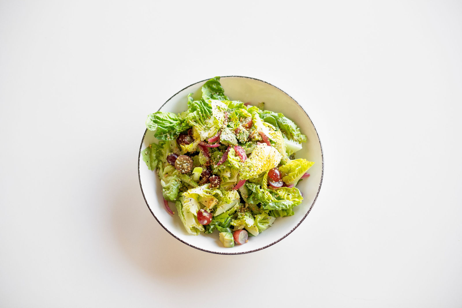 Superfood Caesar Salad — little gem, red grapes, avocado, pickled onions, celery, superfood sprinkles, lemony caesar