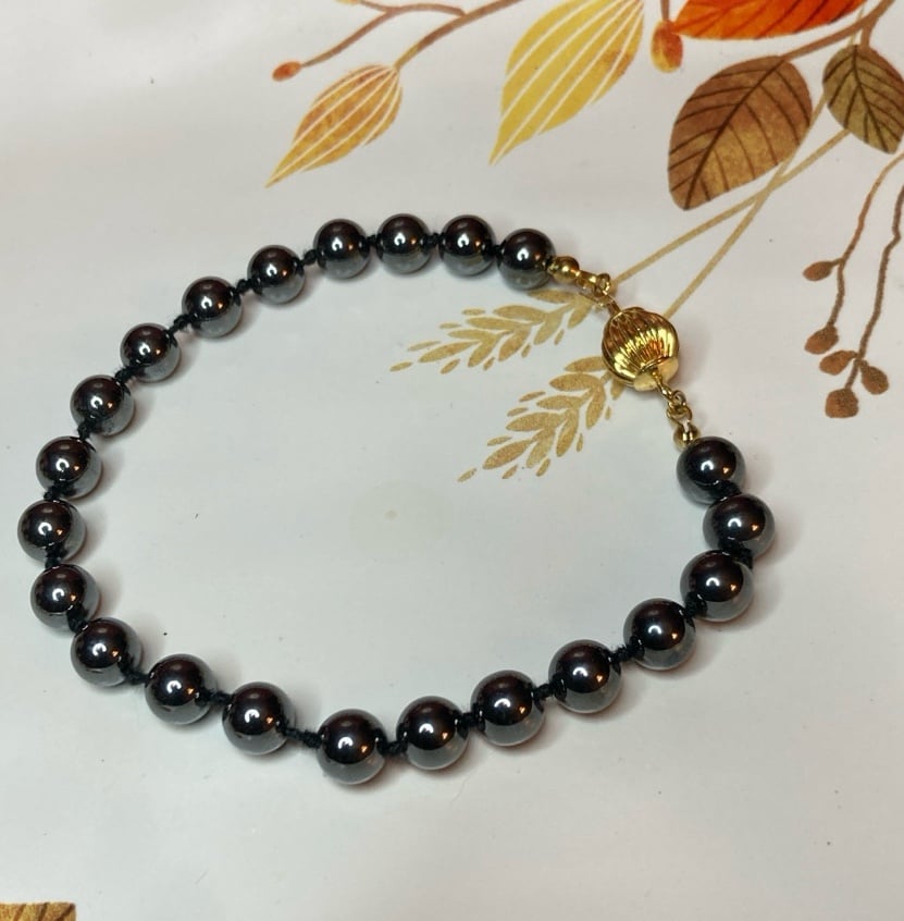 Hematite Glass Beaded Bracelet with Gold Tone Clasp Hand Knotted Beads
