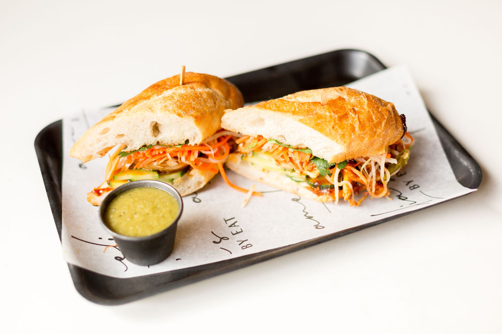 Rotisserie Chicken Banh Mi Sandwich — spicy pickled carrots-daikon, thai bbq sauce, cucumber, noble baguette | sub gf 4