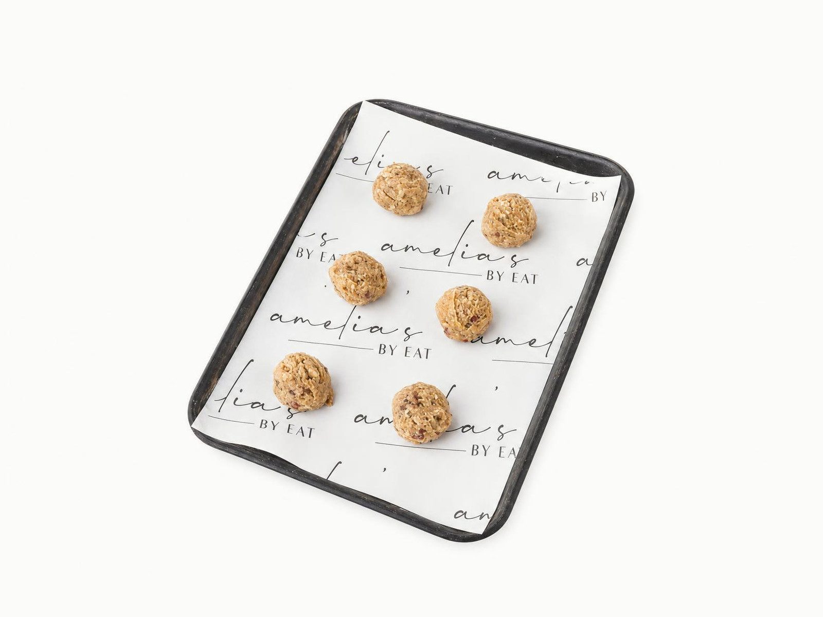 Energy bites on an Amelia's branded paper-lined tray
