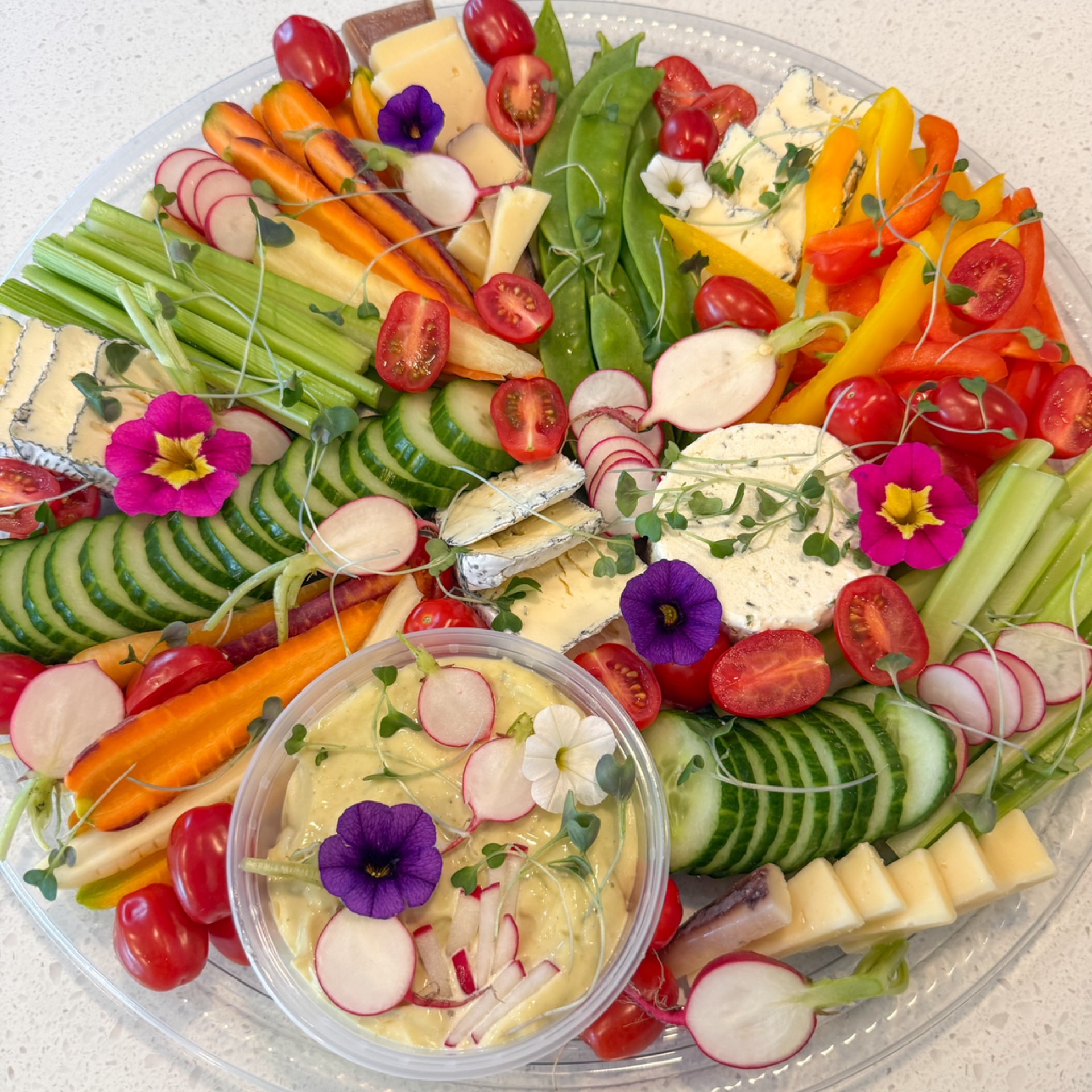Platter of mixed vegetables and cheeses