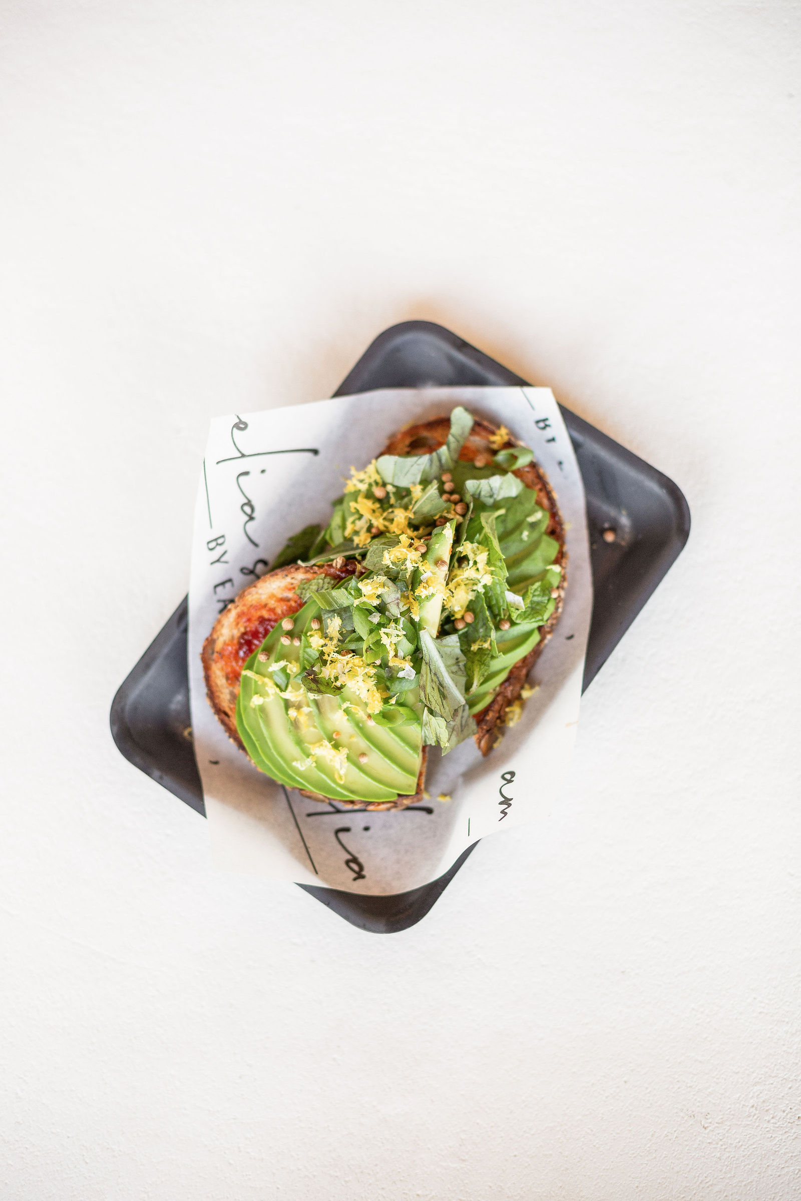 Avocado Toast — calabrian chili honey relish, coriander, lemon zest, hemp seeds, herbs, seeded noble toast | *add egg 3 |