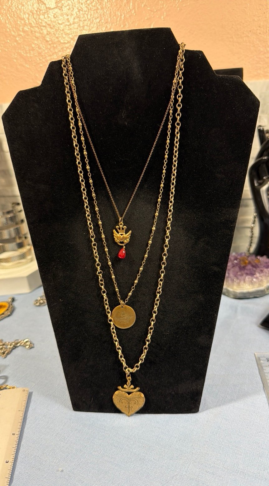 NY layered gold-tone charm necklace