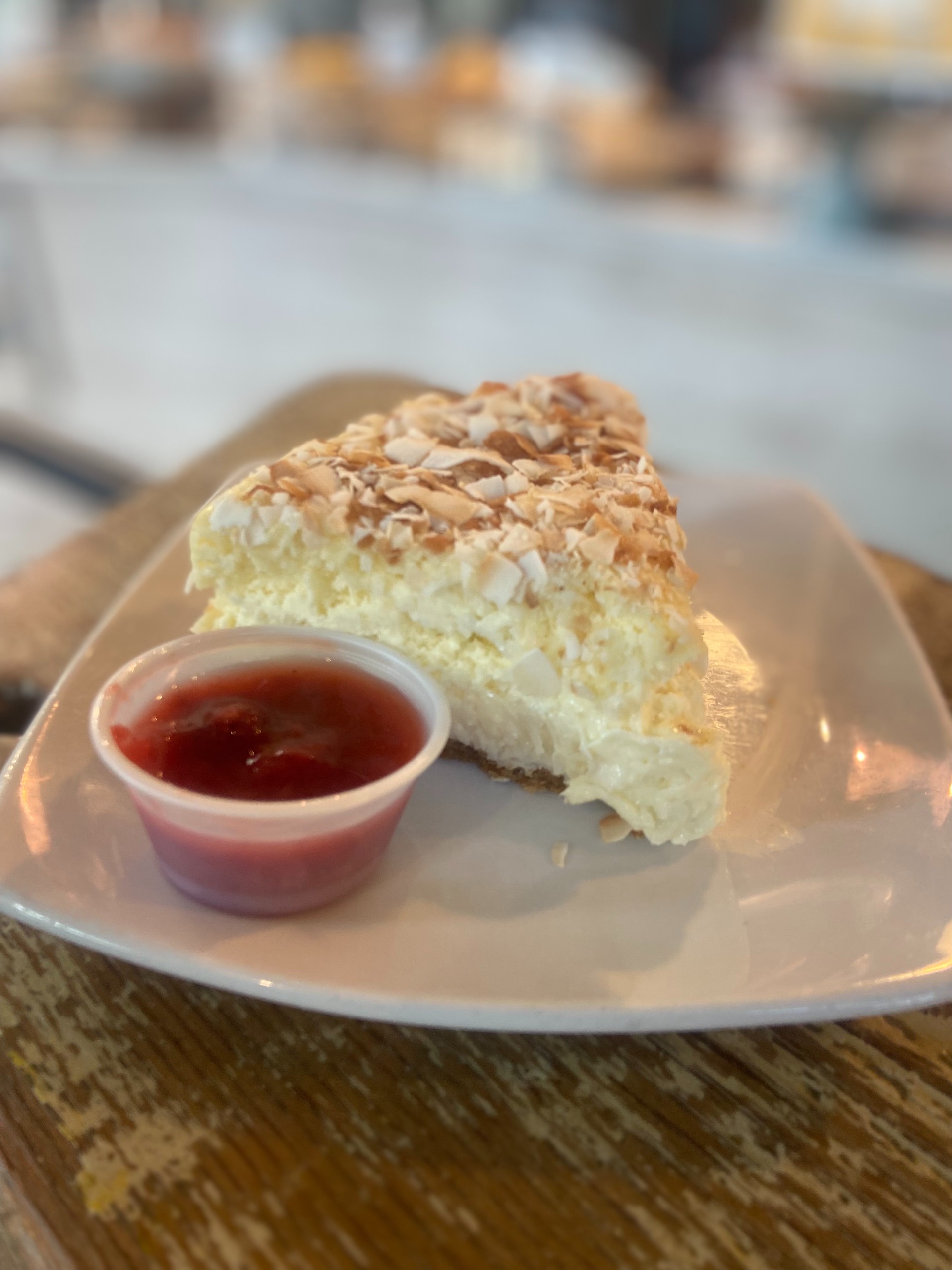 Coconut Cheesecake w/Strawberry Sauce
