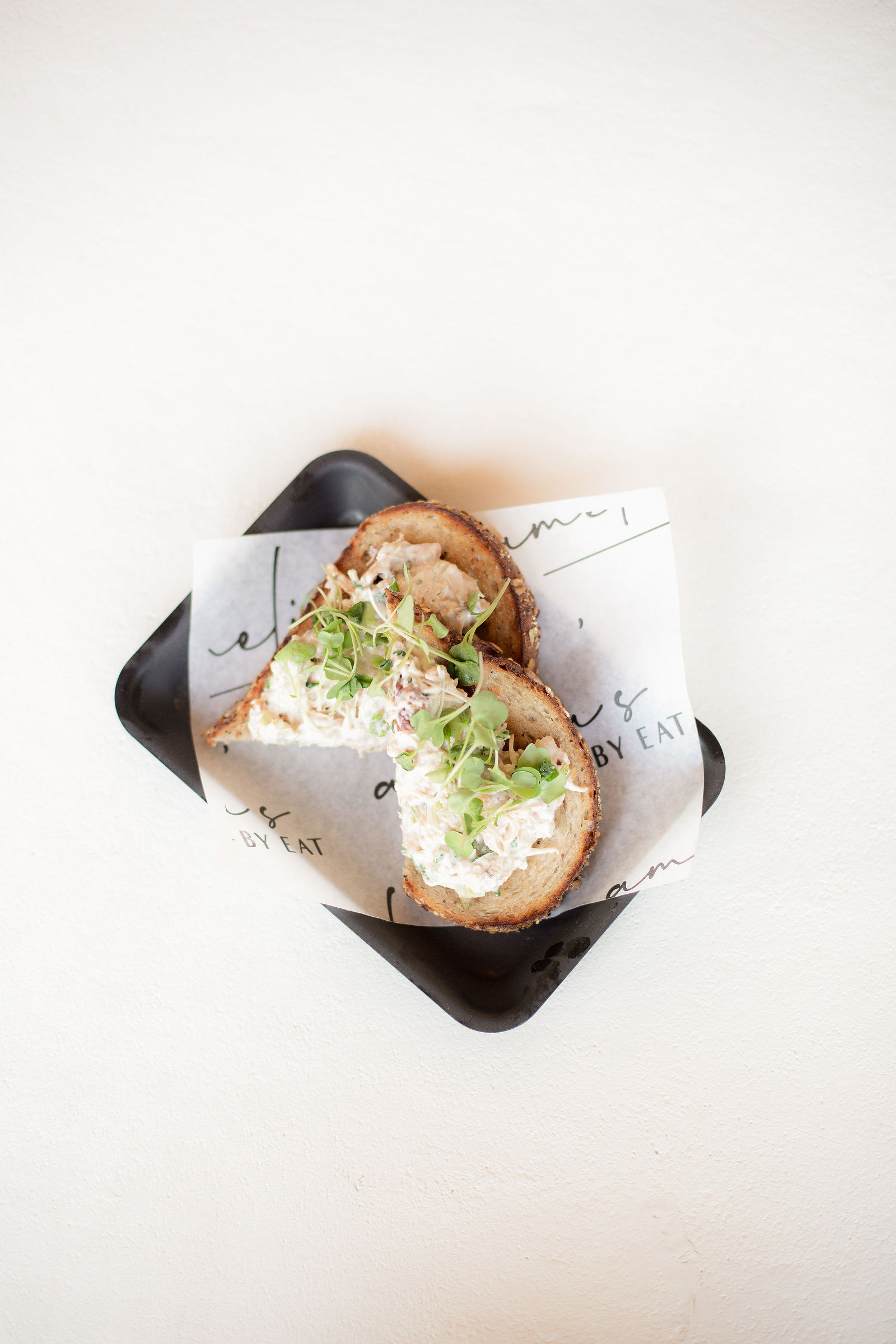 Egg Salad Toast — herby egg salad, hot honey, local micro greens, seeded noble toast or mixed greens | sub gf 2