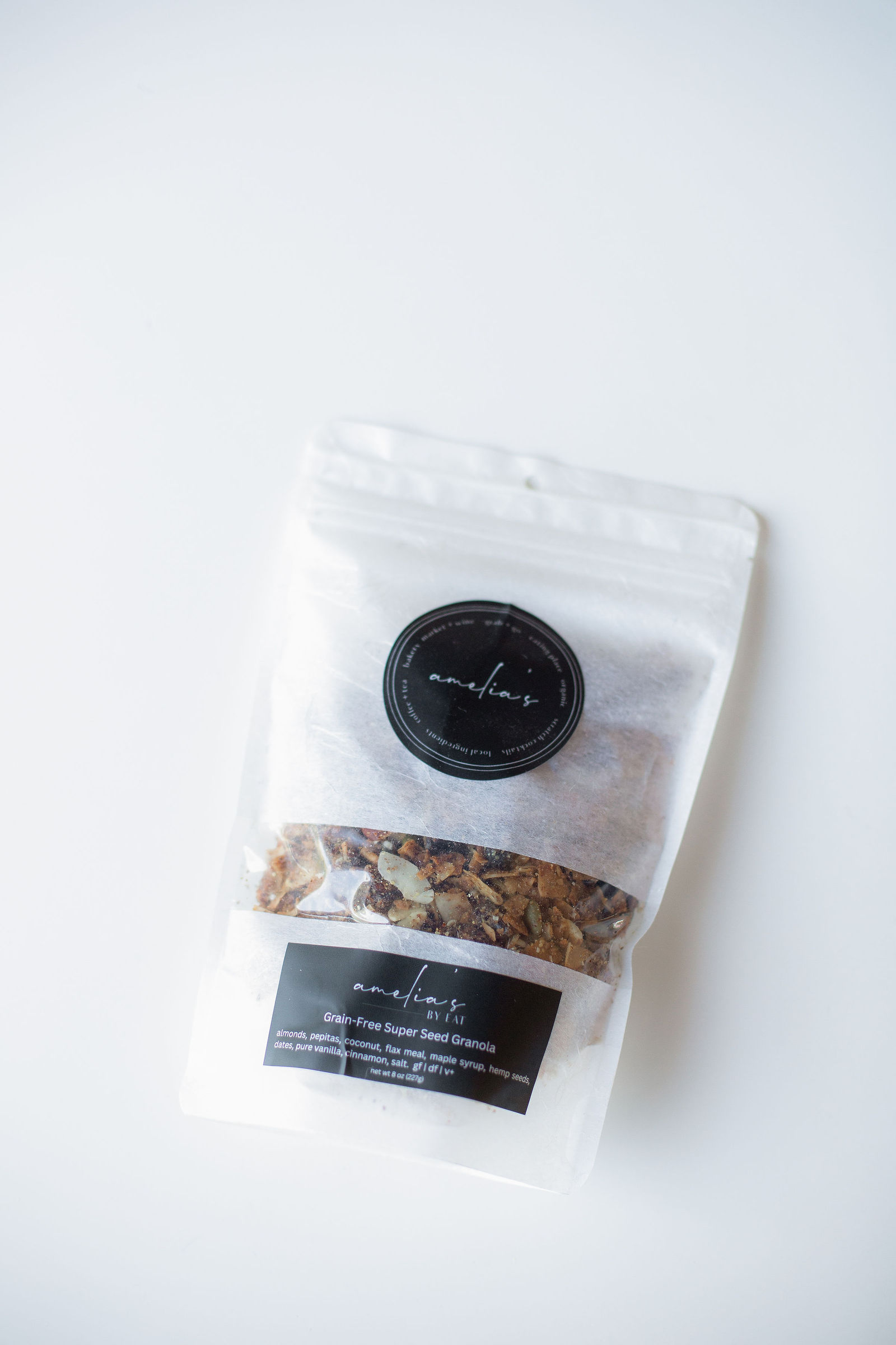 Amelia's Grain-Free Super Seed Granola in a clear resealable pouch with black labels