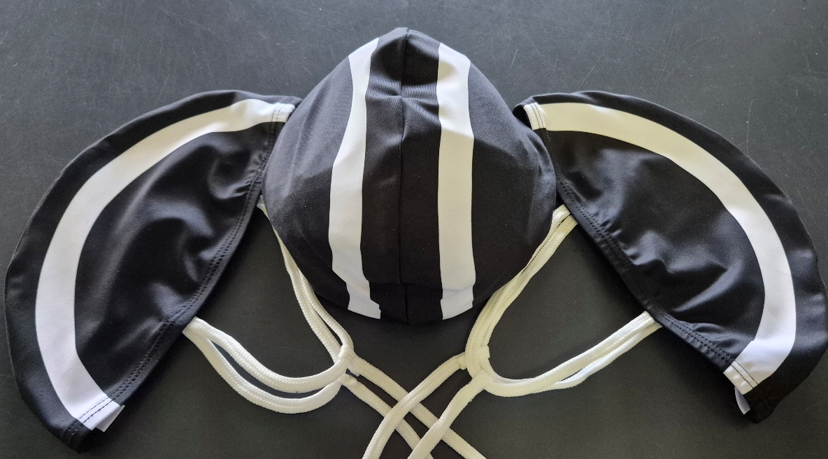 Three black-and-white Mollymook competition caps arranged together to show the available size range.